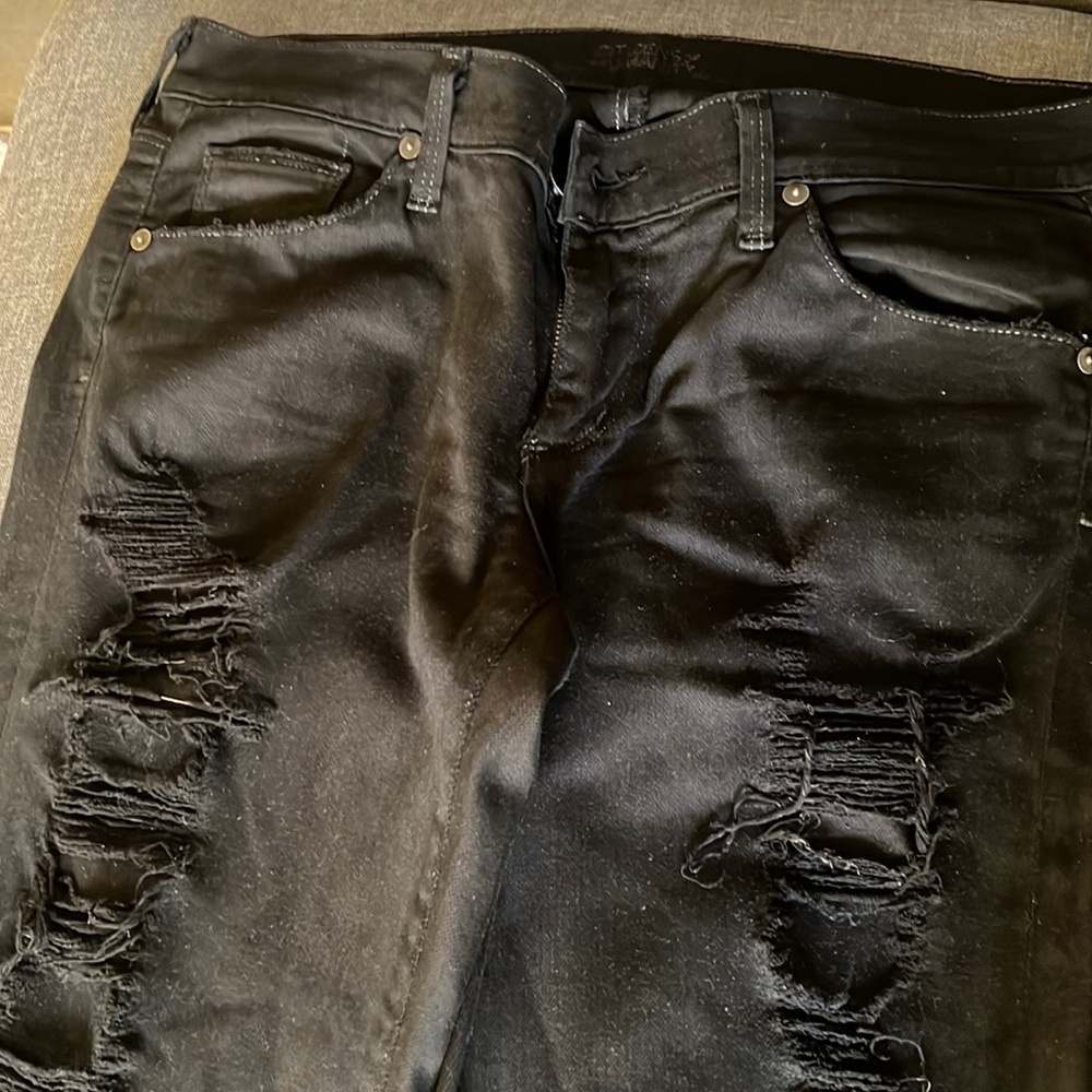 black denim distressed jeans